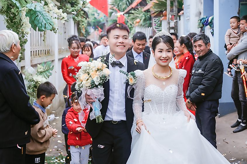 Vinh Phuc, Vietnam February 27, 2024: The bride and groom at the wedding ceremony were truly happy with the whole family warm and happy.