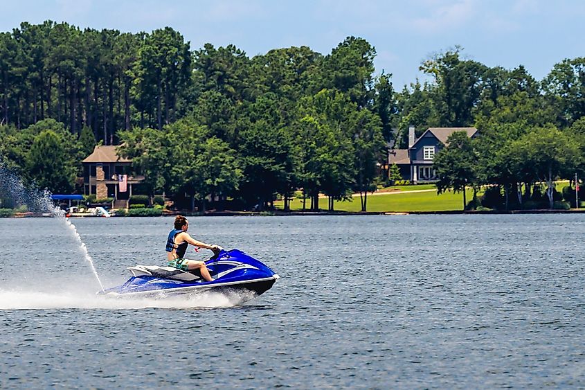 A man riding a jet ski in Lake Oconee along Greensboro in Georgia. 