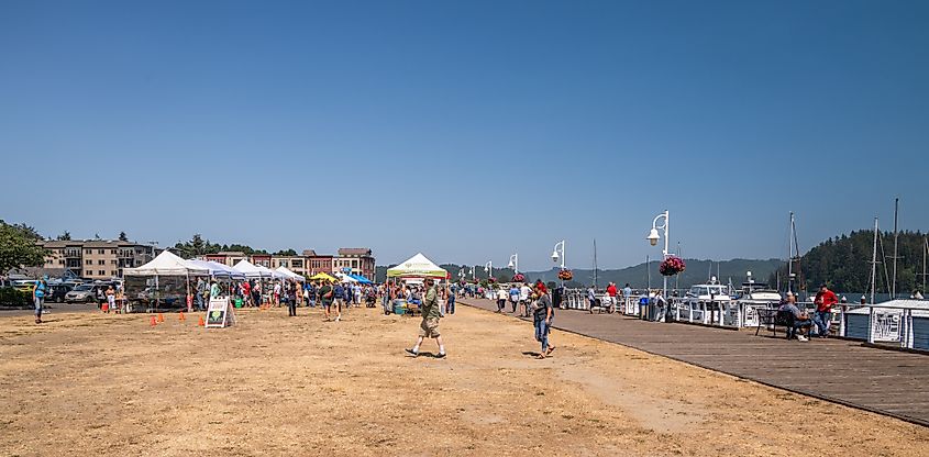 People on Boardwalk and Farmer's Market In Florence, Oregon