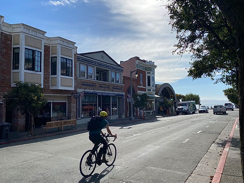 A cyclist cruises through downtown Sausalito and towards the waterfront.