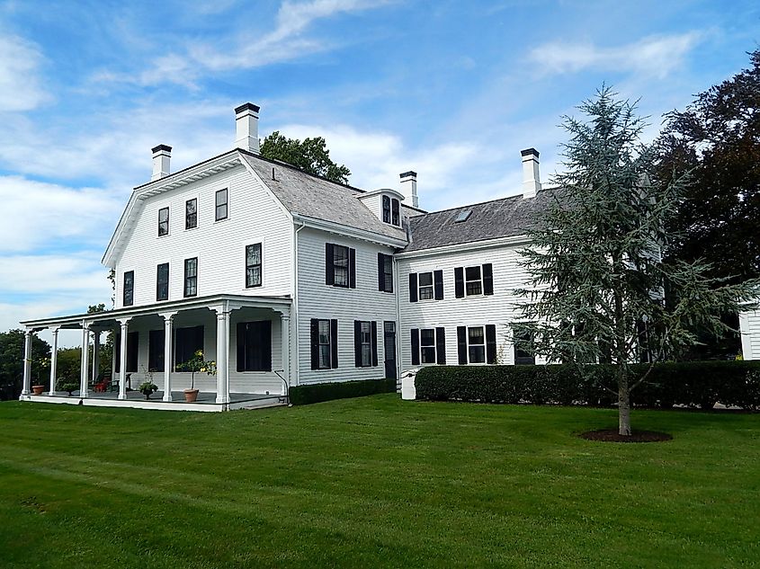 The Brayton Estate House mansion, built in 1872 by Thomas E. Brayton, overlooking Narragansett Bay in Portsmouth, Rhode Island, with the Green Animals Topiary Garden in the foreground.