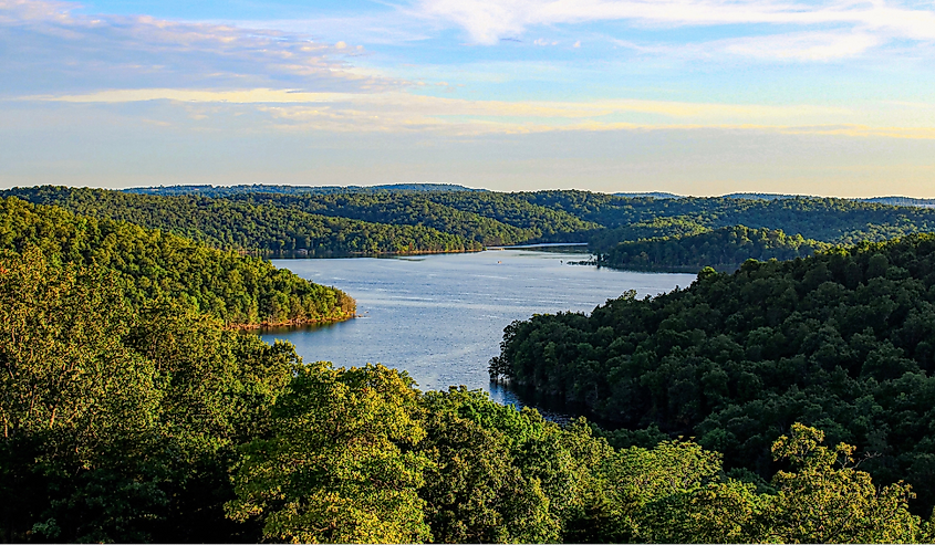 The evening sun shining over Norfork Lake and the surrounding mountains in Mountain Home, Arkansas