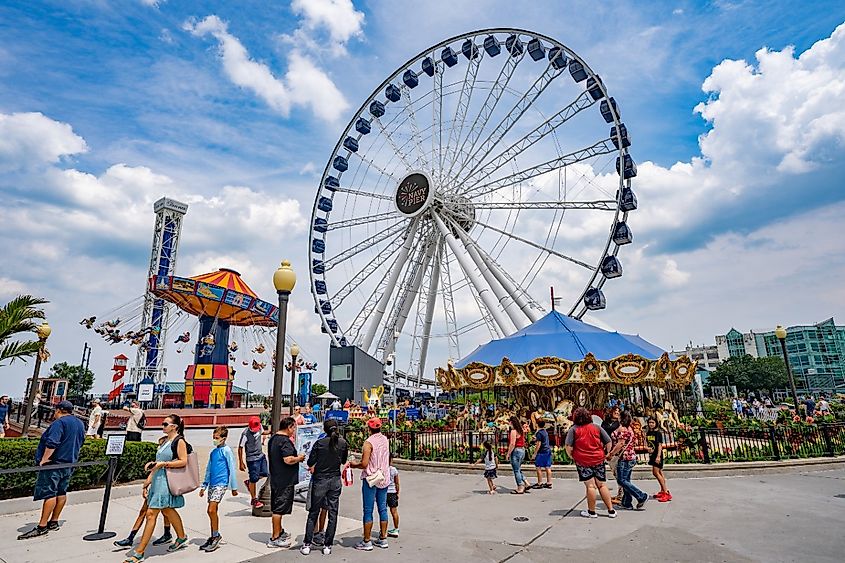 Navy Pier Park attractions on blue sky background during summer season in Chicago, Illinois.