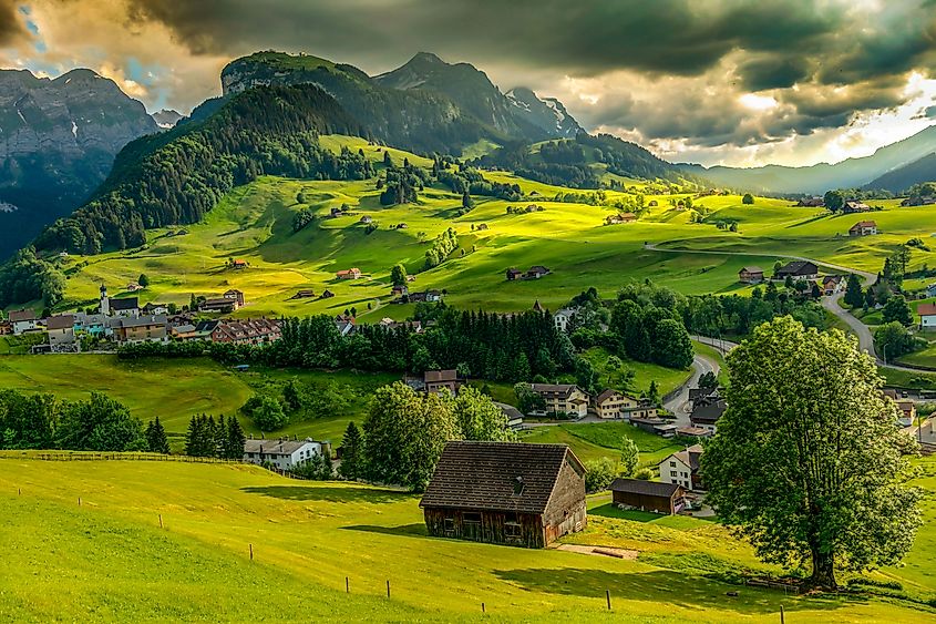 The Appenzell region in Switzerland, known for its green hills, traditional houses, and Alpine mountains.