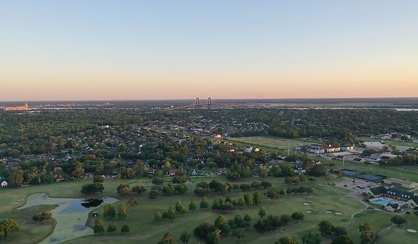 Destrehan's golf course with the Hale Boggs Memorial Bridge in the background at sunset.