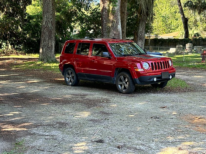 Red car in woods