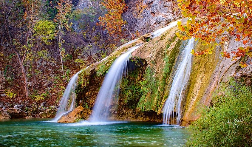 Color photograph of Turner Falls waterfall (near Davis, Oklahoma) during fall / autumn.