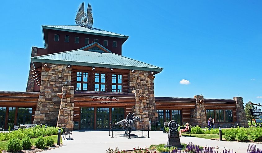 Archway Monument in Kearney, Nebraska. Wooden building with gardens and paved paths. 