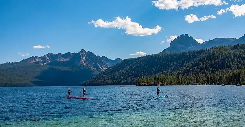 Paddle boarding on Redfish Lake in the Sawtooth Mountains in Idaho.