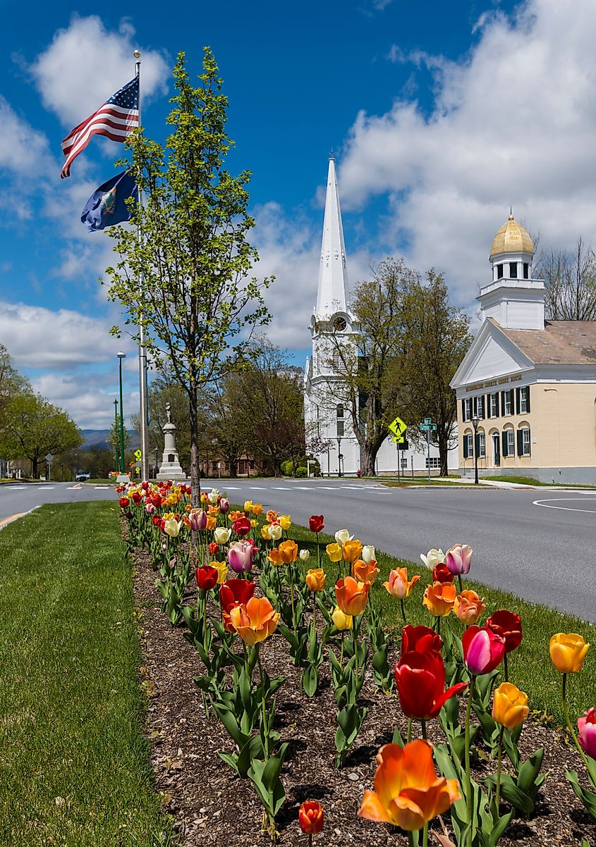 View of the historic and colorful Manchester Village in Manchester, Vermont, with tulips in bloom.