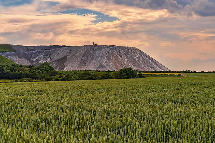 Clouds over the spoil heap of a potash mine near Altenhagen, Lower Saxony, Germany.