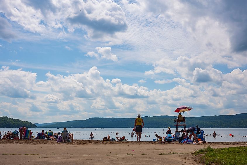Crowds flock to the beach at Glimmer-glass State Park in Copperstown, New York