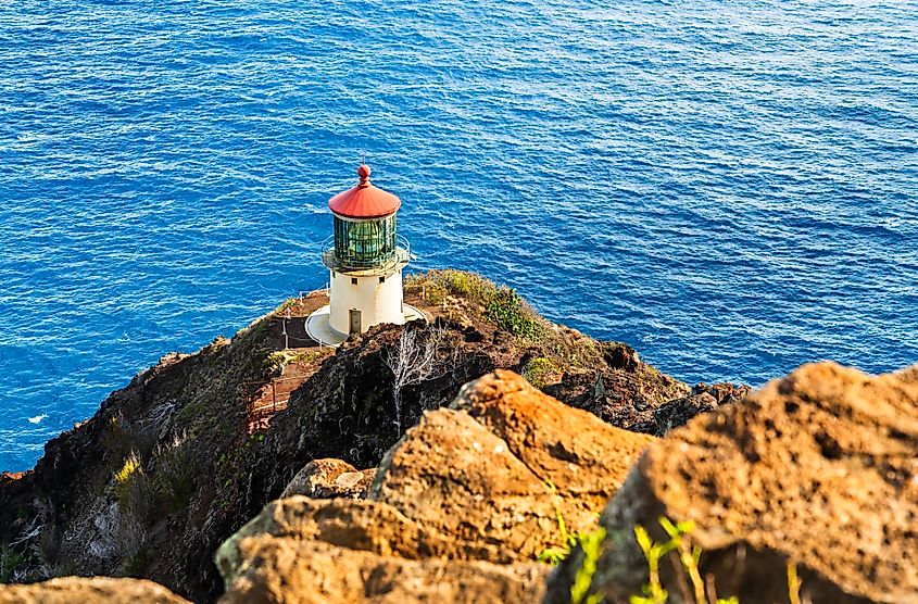 Makapuʻu Lighthouse perched on a rocky cliff overlooking the ocean on Oʻahu Island, Hawaii