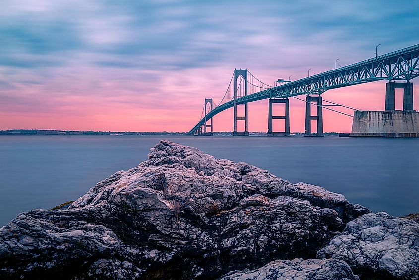 Sunset over Claiborne Pell Newport Bridge, a modern tolled suspension bridge spanning Narragansett Bay and connecting Newport and Jamestown, Rhode Island.