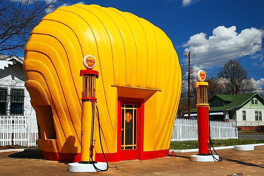 A vintage yellow Shell gas station, built the resemble the company’s scallop shaped logo still stands as a roadside attraction in Winston-Salem, North Carolina.