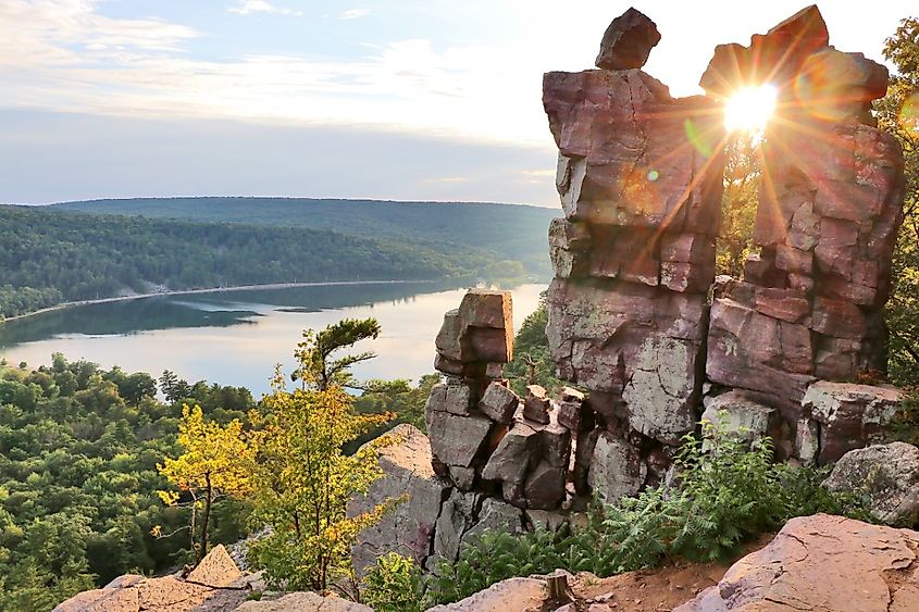 Areal view on the South shore beach and lake from rocky ice age hiking trail during sunset. Devil's Doorway location.