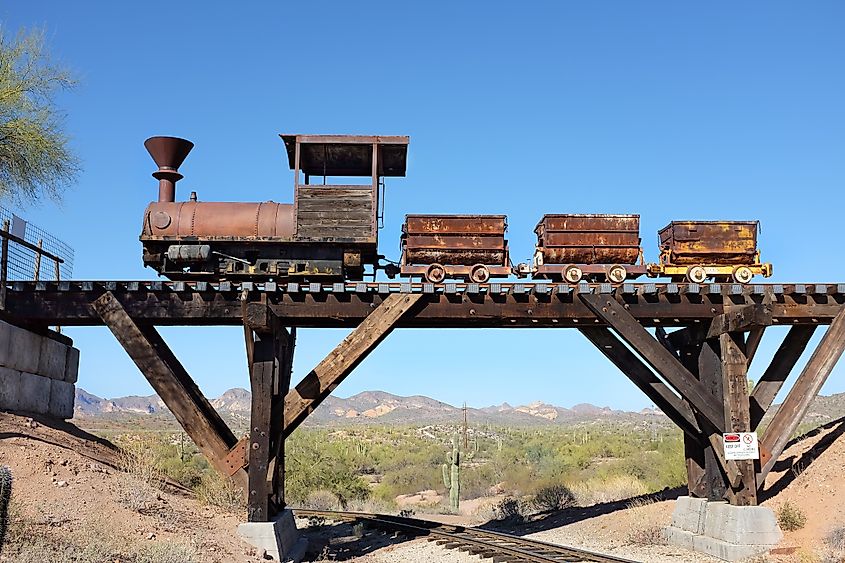 Ore Cars on trestle at the Goldfield Ghost Town, in Apache Junction, Arizona. Editorial credit: Steve Cukrov / Shutterstock.com