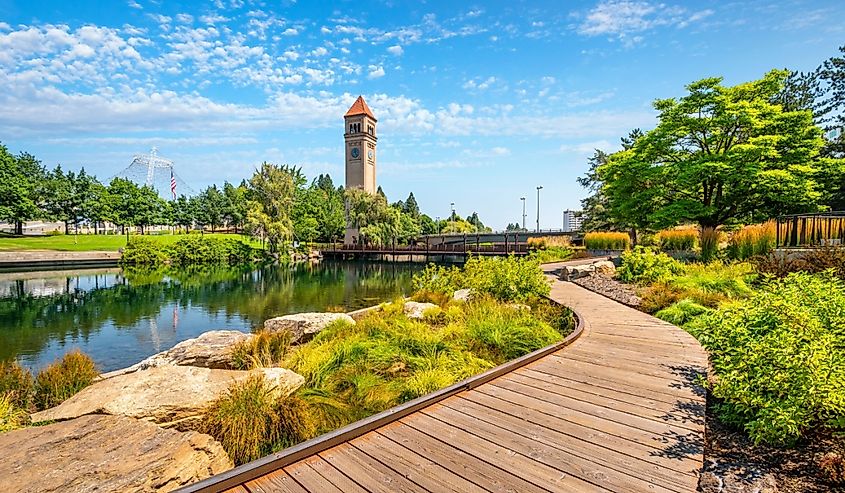 View of the Great Northern Clock Tower, Expo Pavilion, Spokane River and landscaped pathway at Riverfront Park