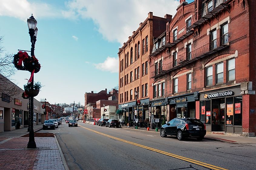 Historical buildings and retail stores along Main Street in downtown Marlborough, Massachusetts, showcasing classic architecture on a calm autumn day.