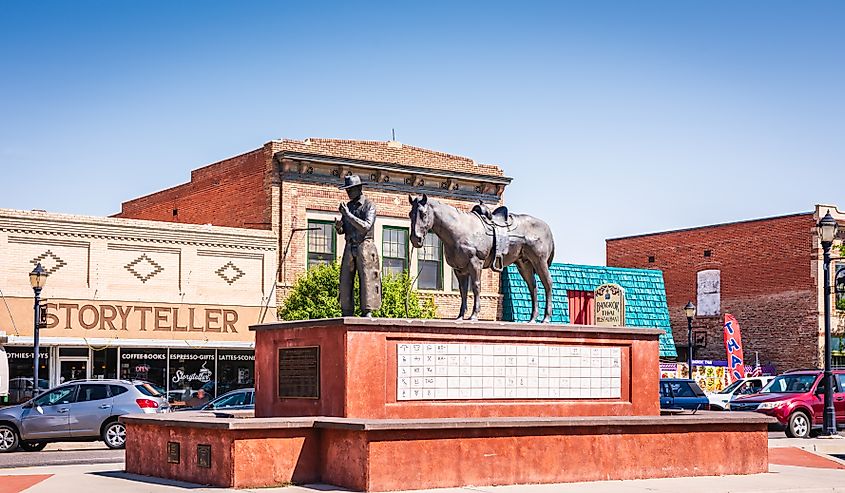 The bronze Soil to Riches statue by Carl Jensen on Broadstreet in Thermopolis, Wyoming. 