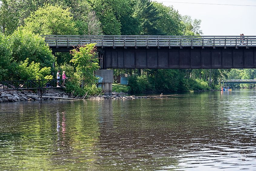 People fishing along the Wolf River in Shawano, Wisconsin.