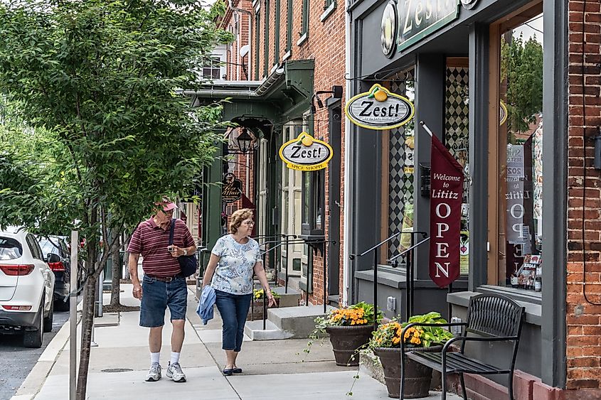 Senior couple waking on Main Street, Lititz, Pennsylvania.