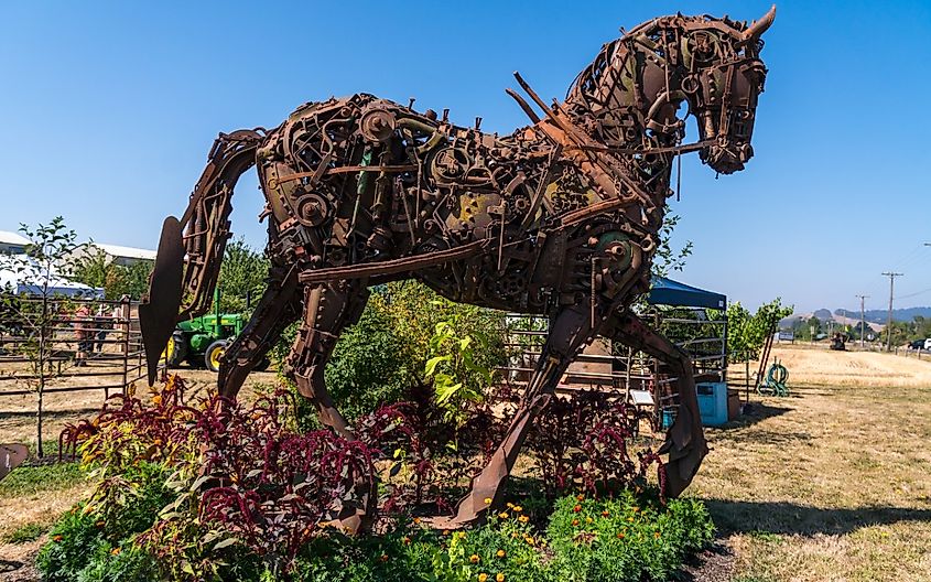 An iron horse built out of recycled farming equipment parts and knots and bolts in McMinnville, Oregon.