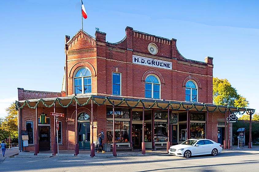 Old brick building housing an antique store in Gruene, Texas