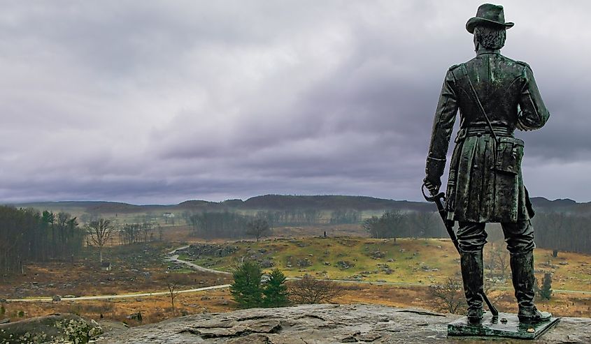 A statue of General Warren overlooks the Wheat Field and Devil's Den, parts of the battlefield at Gettysburg from the Civil War, Gettysburg, Pennsylvania.