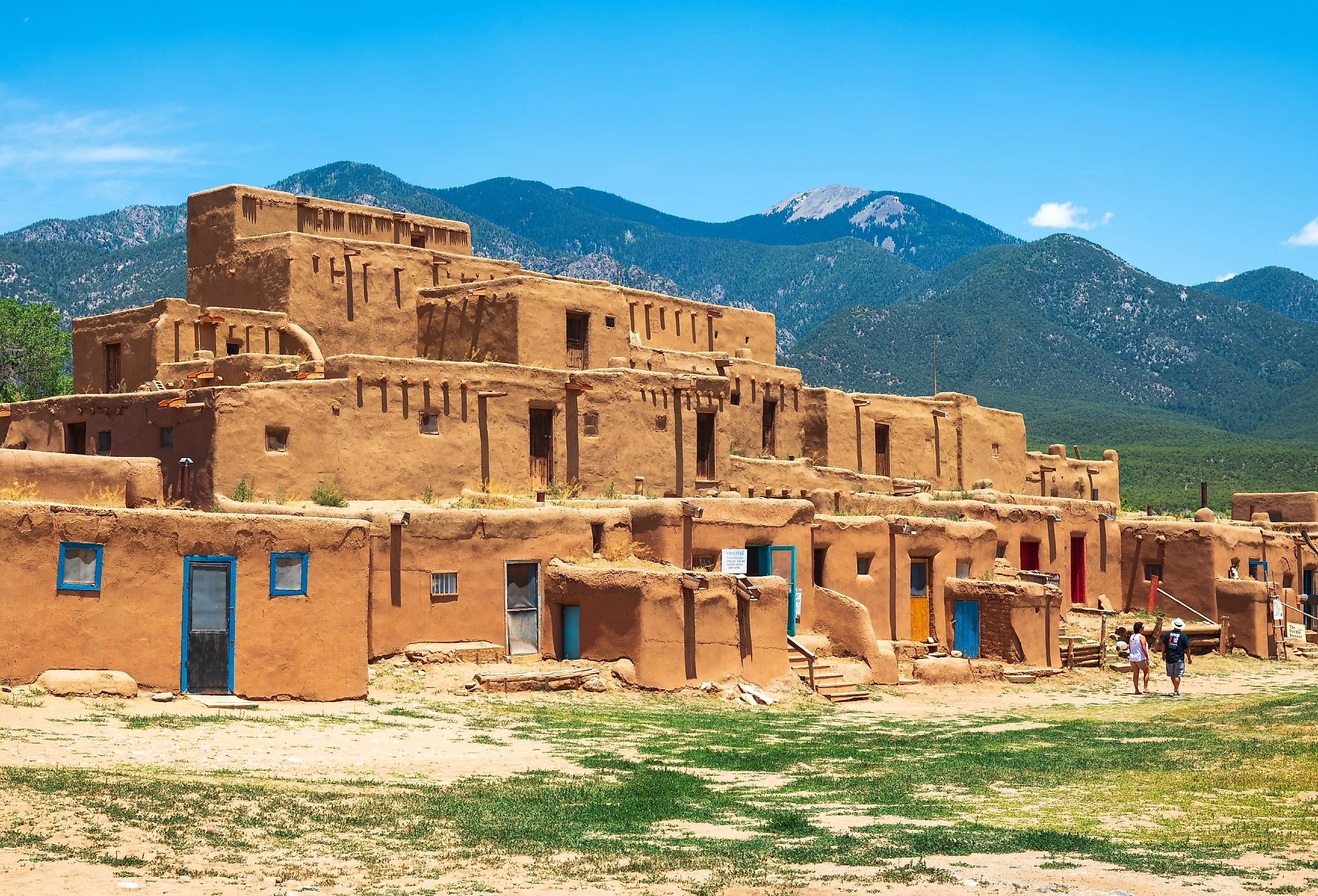 Tourists visit the historic Taos Pueblo, New Mexico. Image credit Sean Pavone via Shutterstock