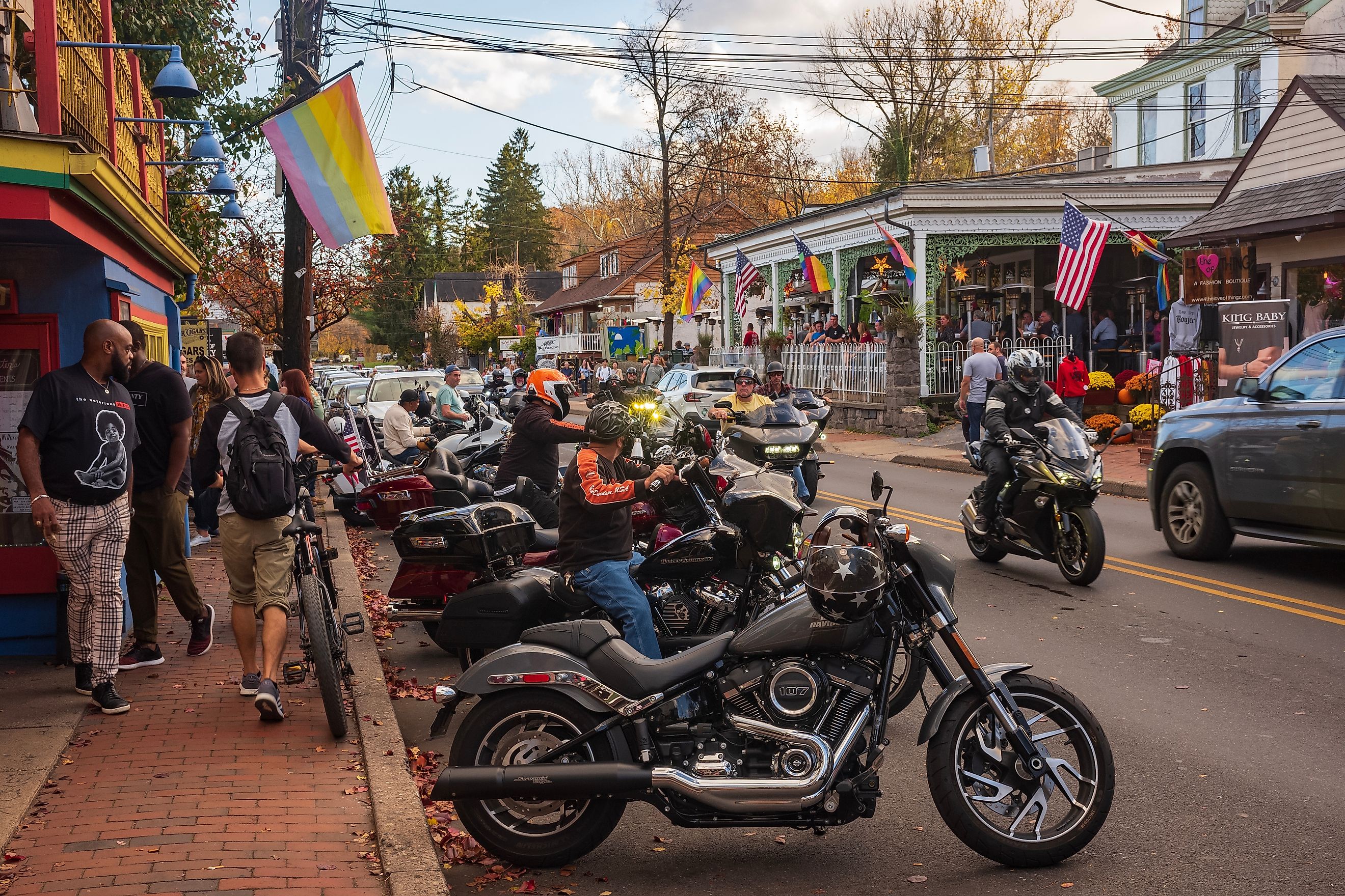 Main Street in New Hope, Pennsylvania, bustling with activity as exotic motorcycles and cars cruise by, highlighting the town's popularity as a travel destination. Editorial credit: JWCohen / Shutterstock.com