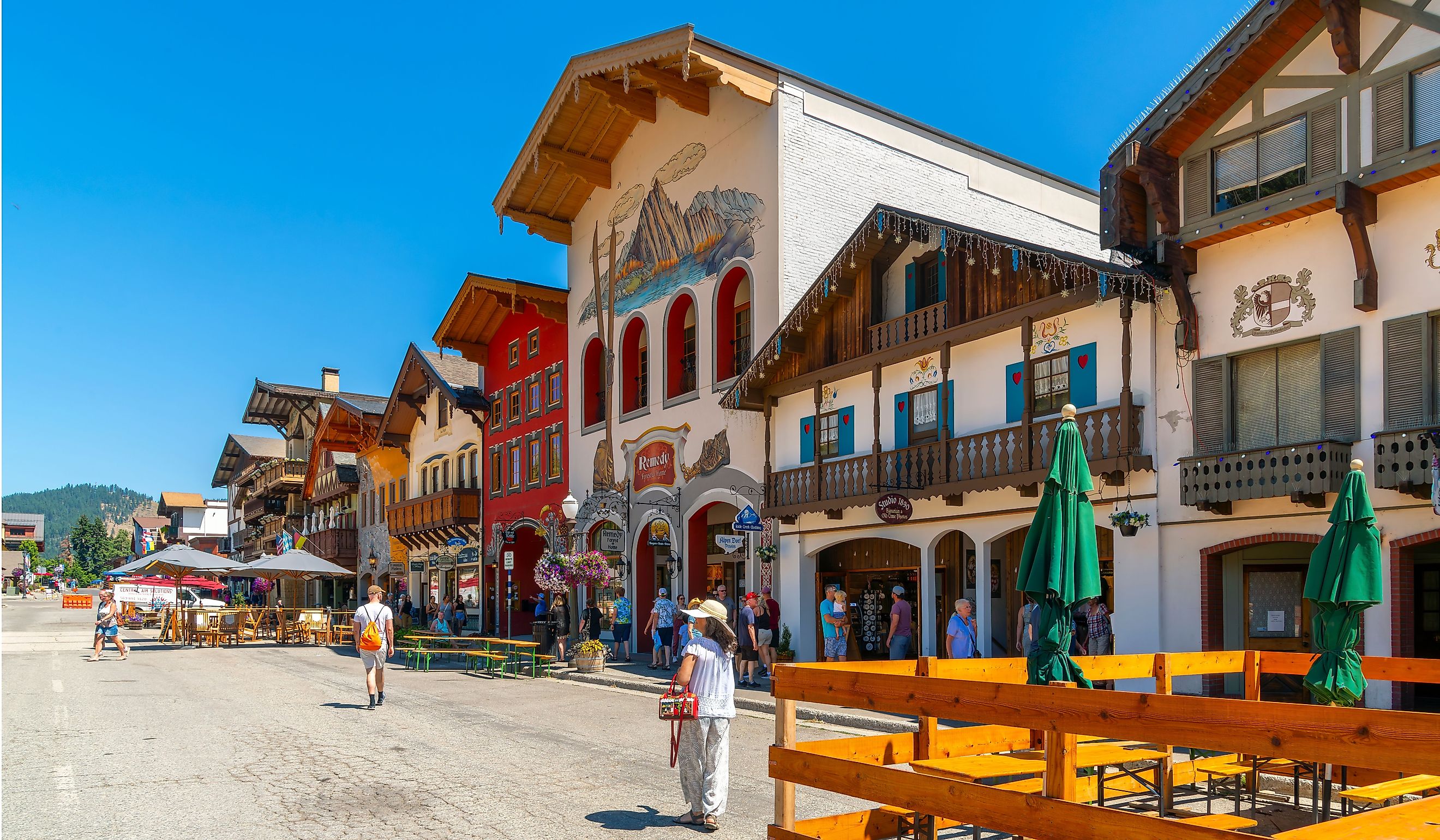 Shops and sidewalk cafes line the quaint Bavarian themed main street of the tourist resort town of Leavenworth, in the mountains of Central Washington State. Editorial credit: Kirk Fisher / Shutterstock.com