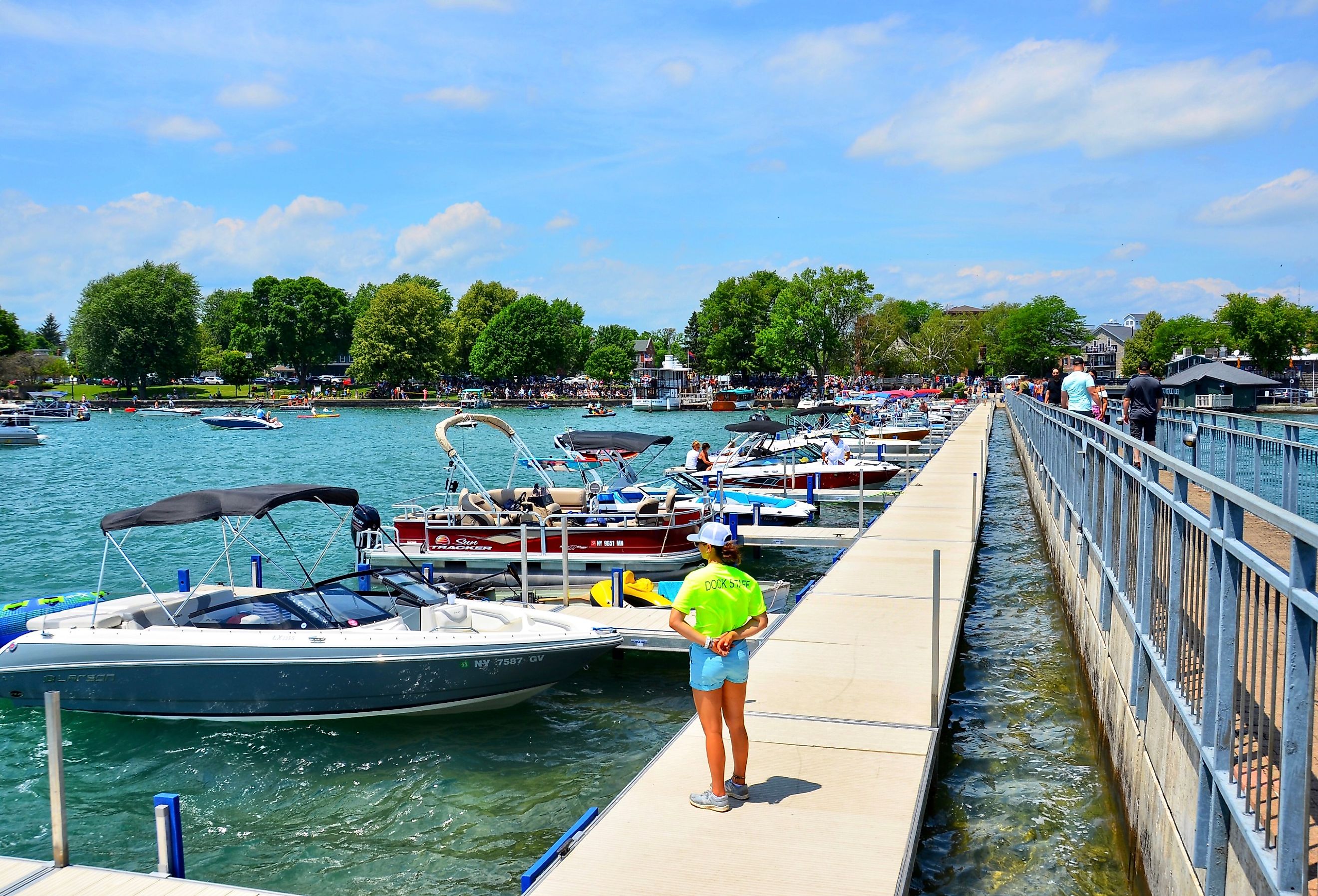 Pier and luxury boats docked in the Skaneateles Lake, New York. Image credit PQK via Shutterstock