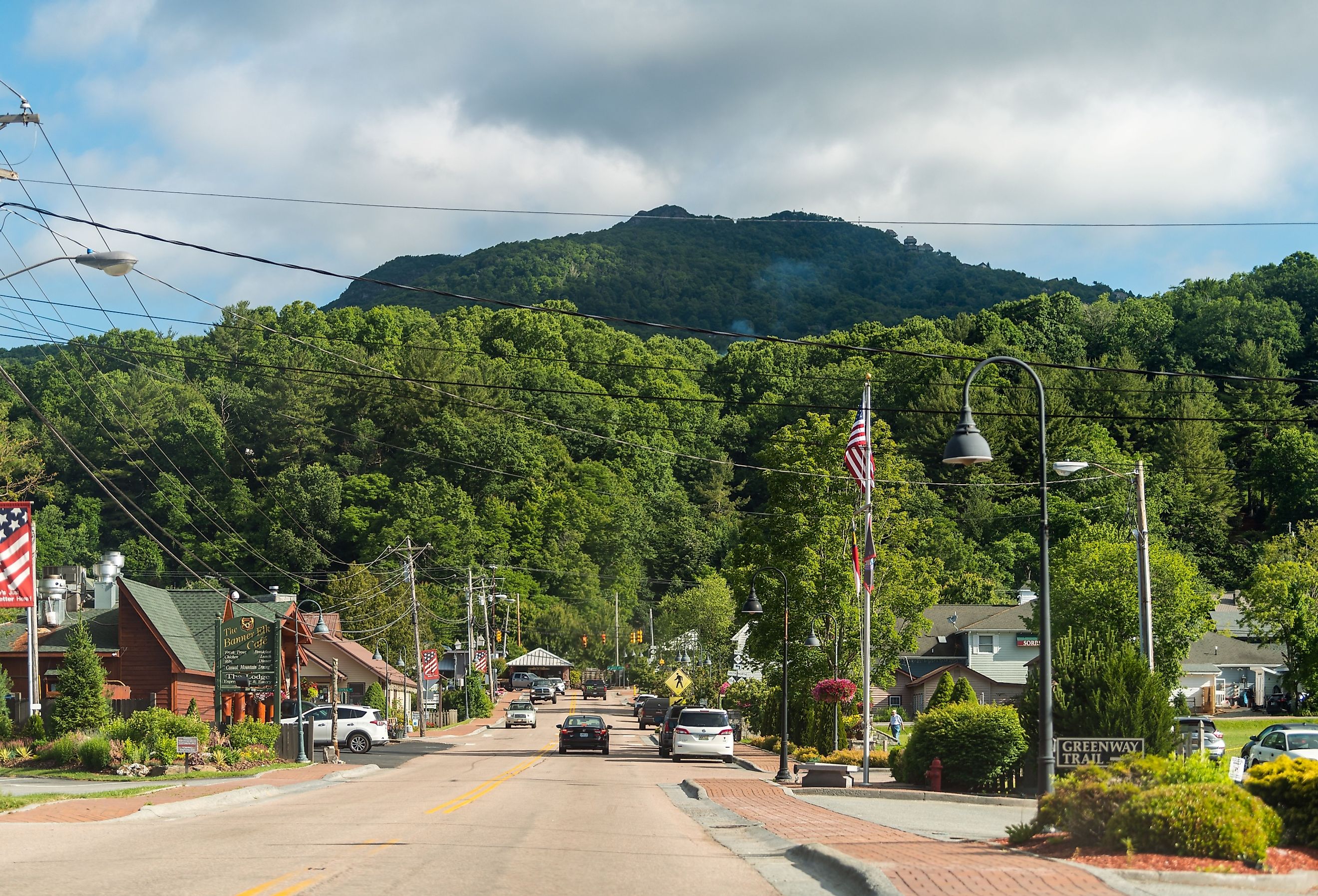 Downtown Banner Elk road street in North Carolina city town famous for Sugar and Beech Mountain ski resorts and store shops restaurants cafe trail sign. Image credit Kristi Blokhin via Shutterstock.