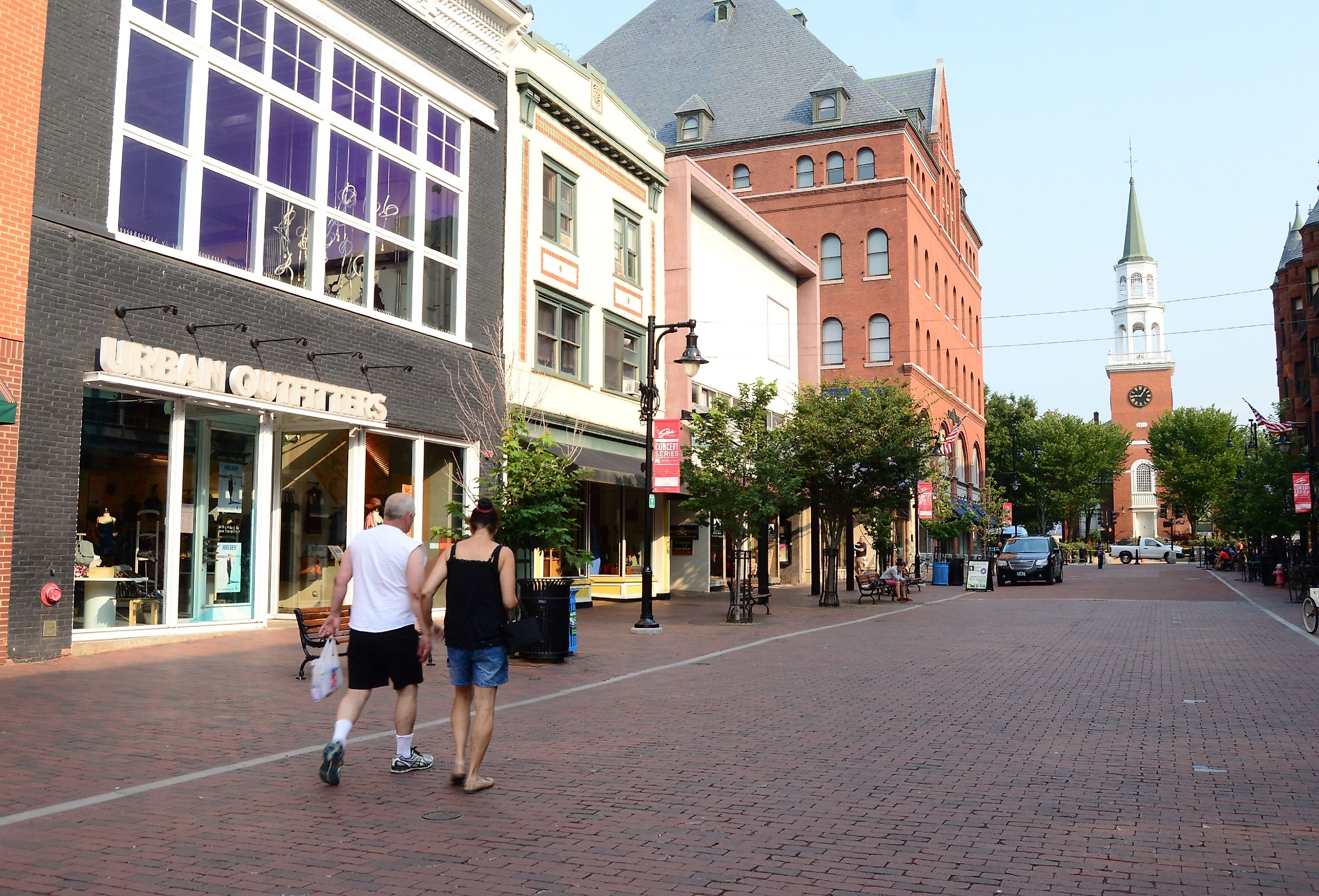 A couple enjoys an early morning walk though the business district of the Church Street Mall in Burlington, Vermont. Image credit James Kirkikis via Shutterstock