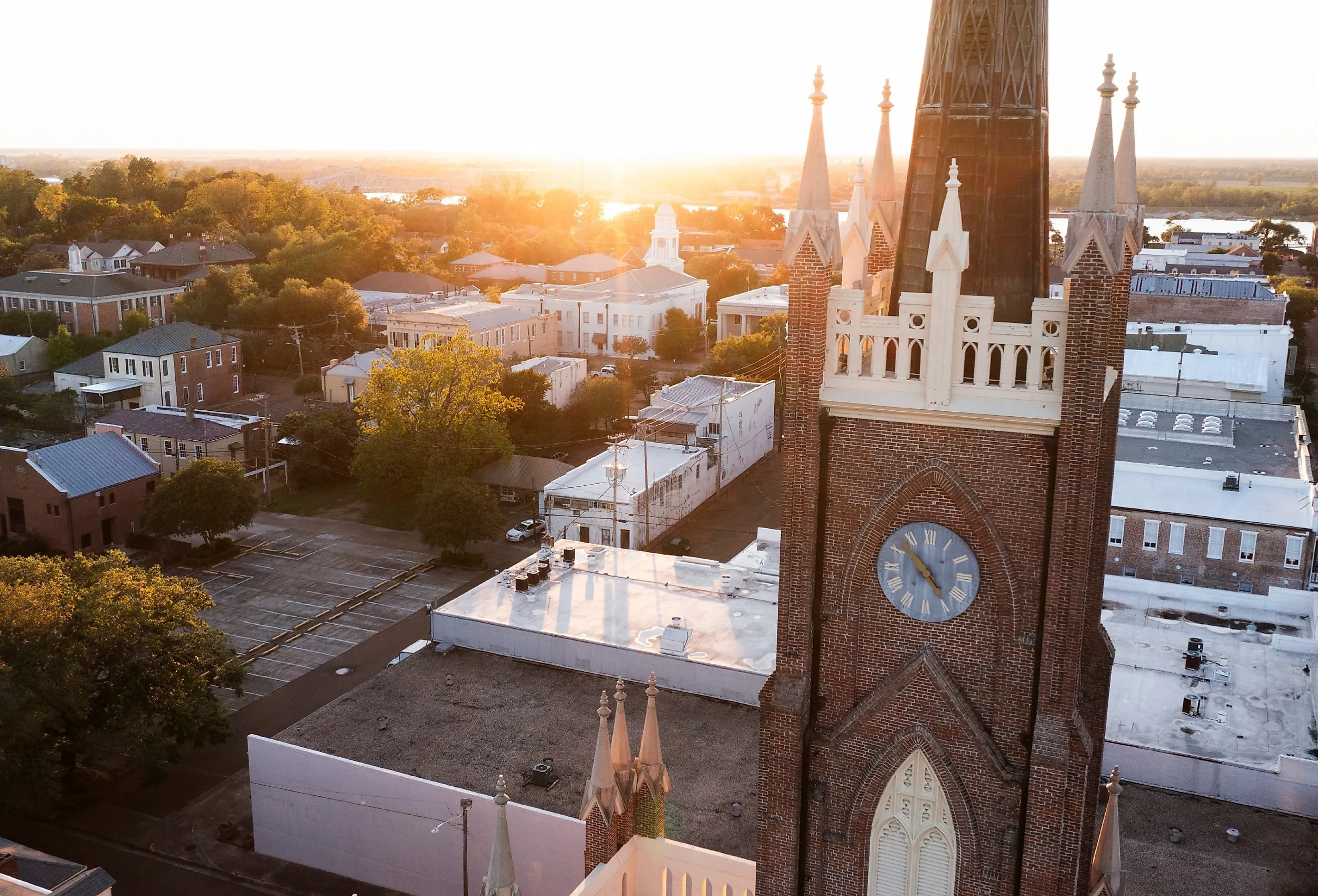 Sunset light shines on a historic church and landscape of downtown Natchez, Mississippi. Image credit Matt Gush via Shutterstock