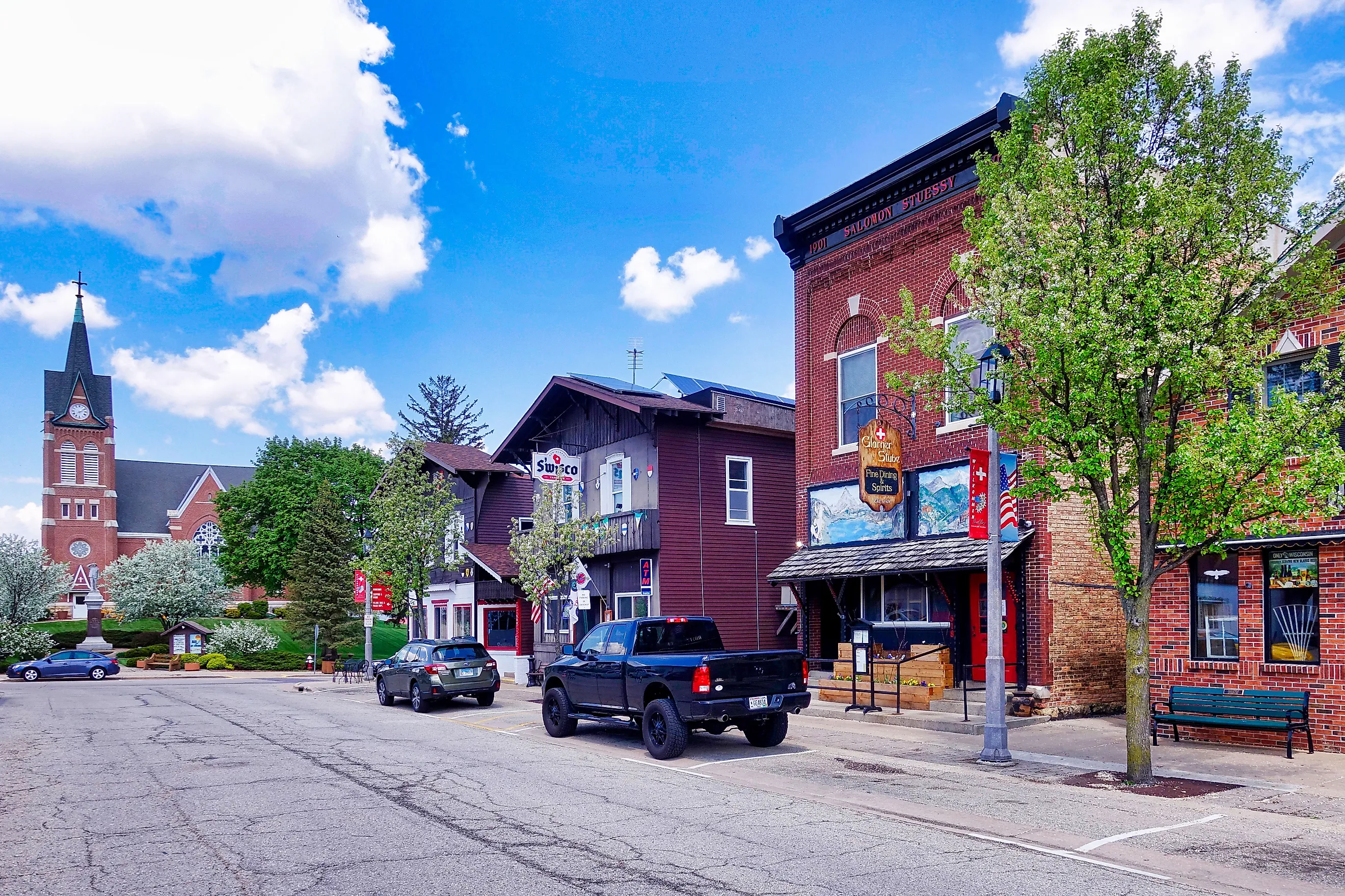 Buildings in New Glarus, Wisconsin, showcasing charming Swiss-inspired architecture with chalet-style facades. Editorial credit: Erwin Widmer / Shutterstock.com