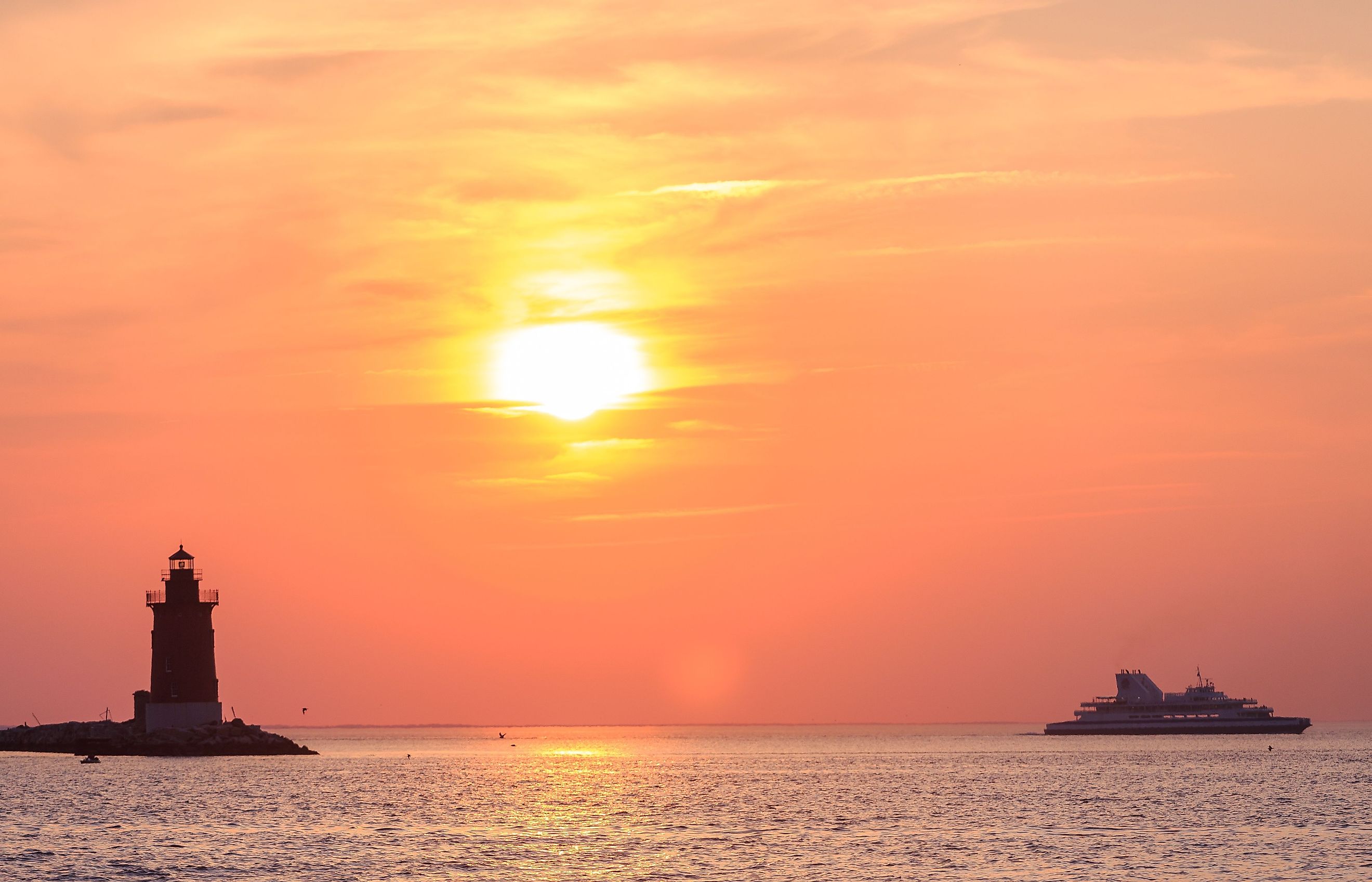 Historic Breakwater East End Lighthouse in Lewes, Delaware, at sunset