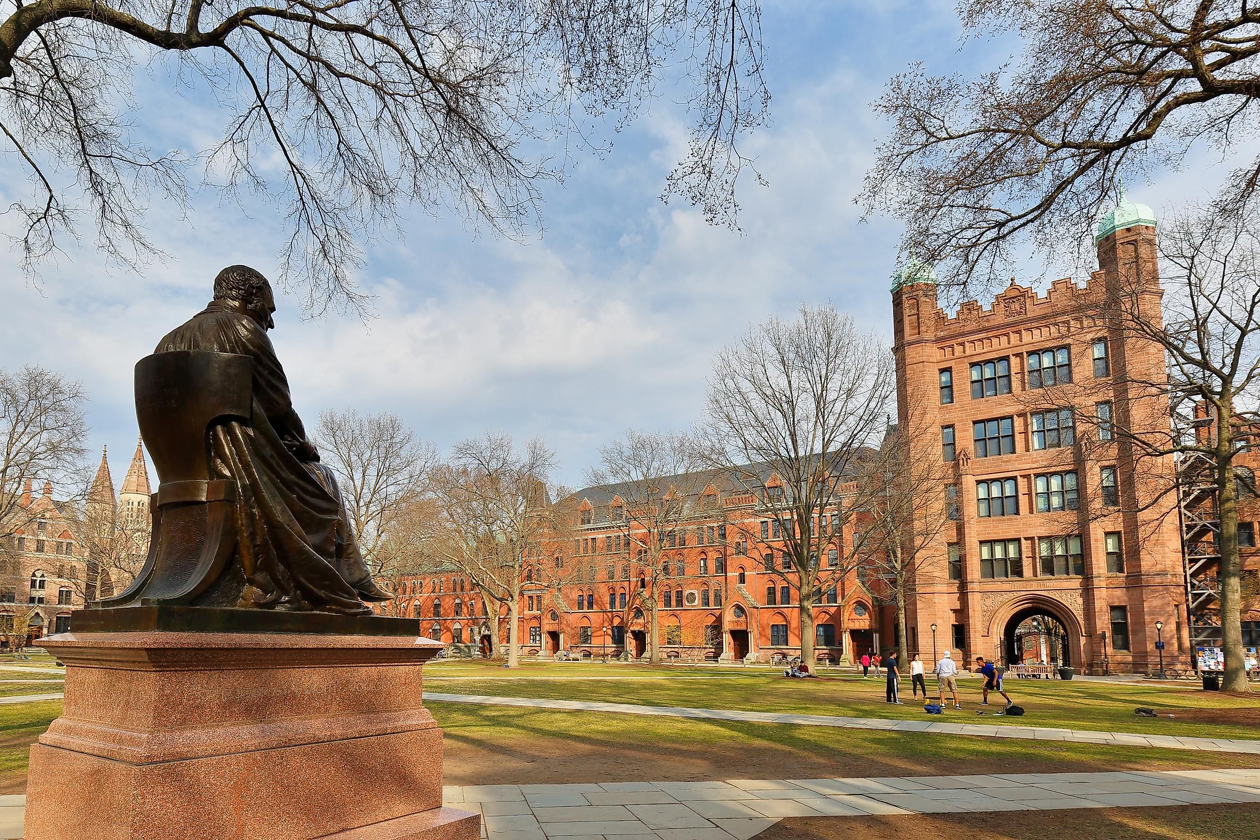 Theodore Dwight Woolsey statue and Phelps Hall on campus of Yale University in New Haven, Connecticut. Image credit: Jay Yuan / Shutterstock.