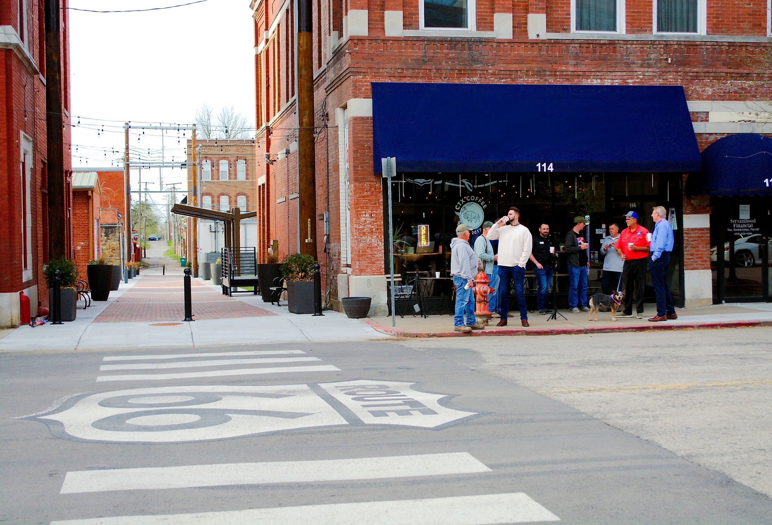 People outside coffee shop on Route 66 at CTX Coffee in Sapulpa, OK. Image credit Richard Affolder via Shutterstock.