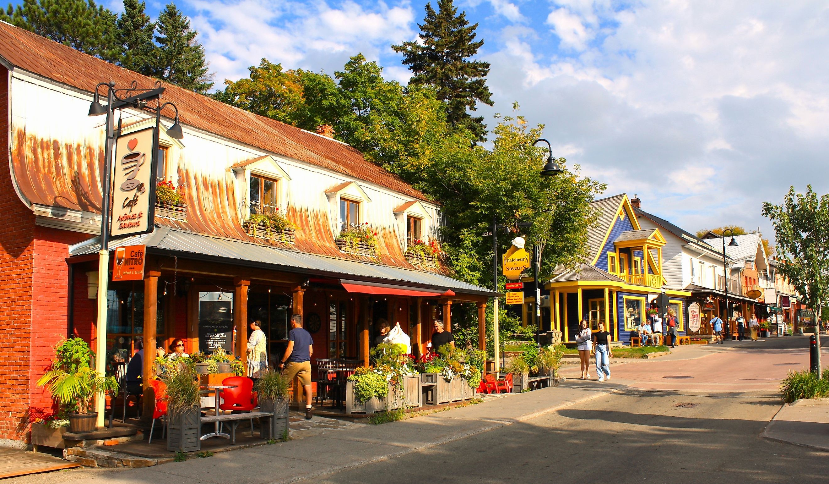 Restaurants line a street in Baie Saint Paul, Quebec. Editorial credit: Juliana.B / Shutterstock.com.