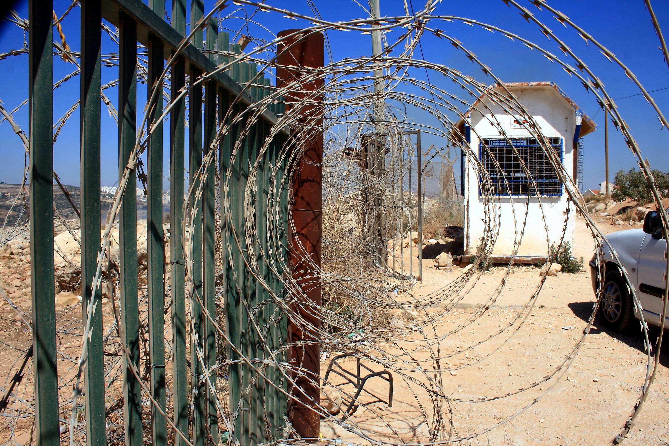 Barbed wire on a fence alongside a border in Israel