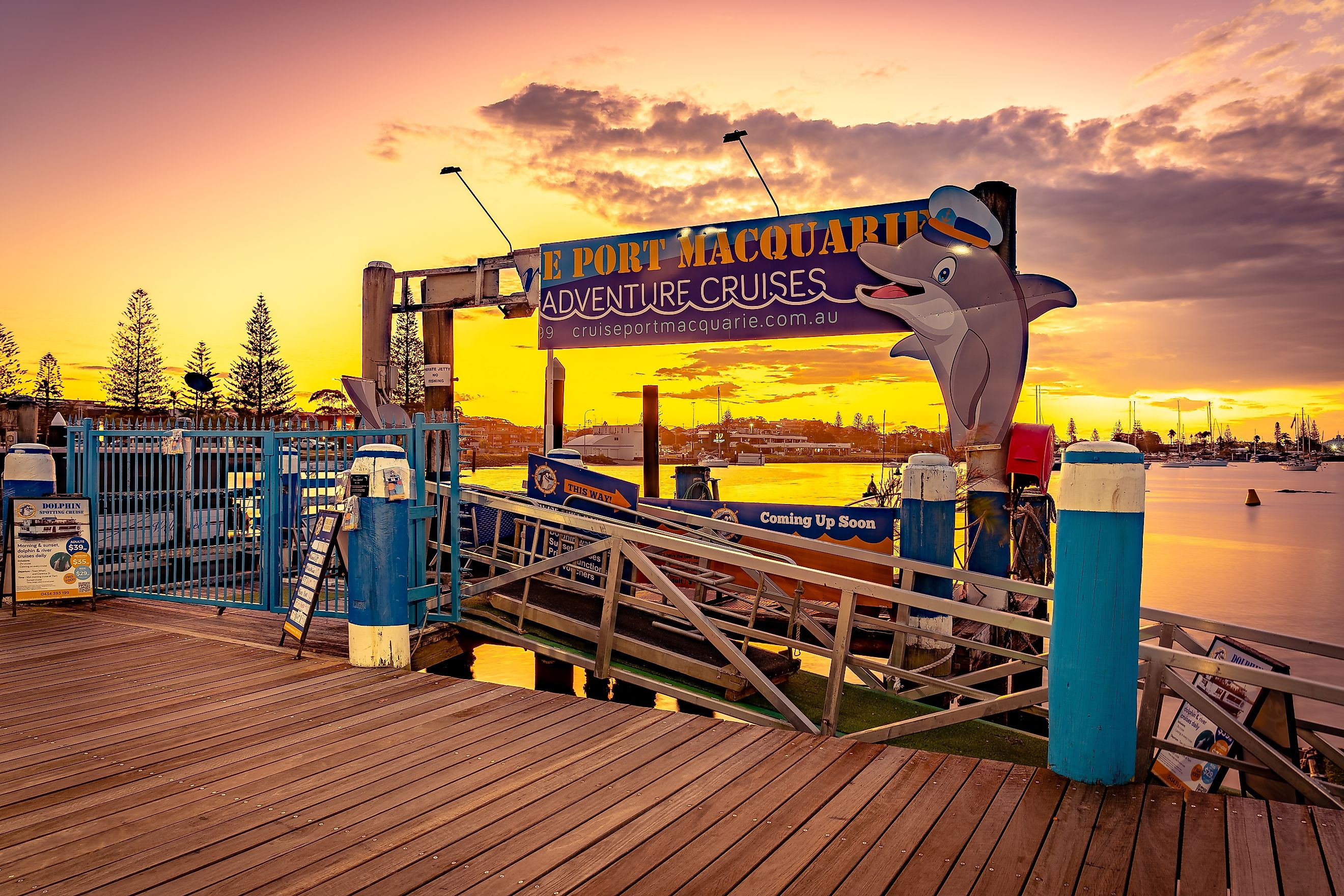 Port Macquarie, New South Wales, Australia: Entrance to dolphin cruise tours at sunset via Alex Cimbal / Shutterstock.com