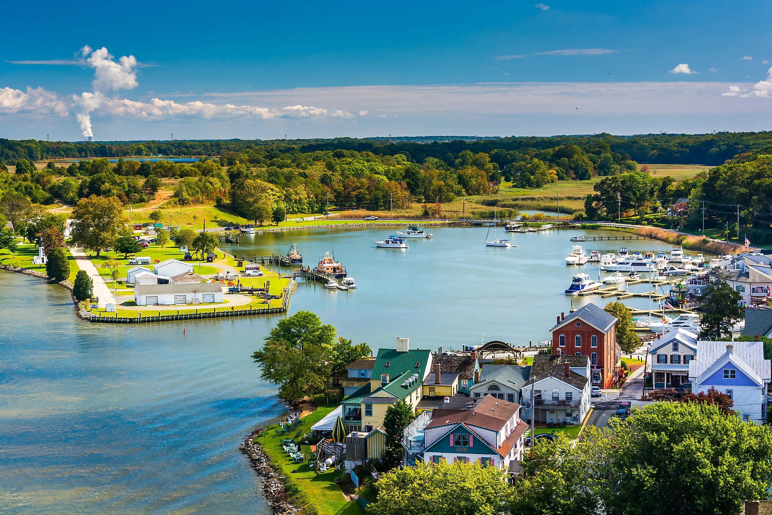  View of Chesapeake City, Maryland, from the Chesapeake City Bridge, showing the town's waterfront, historic buildings, and boats along the canal.