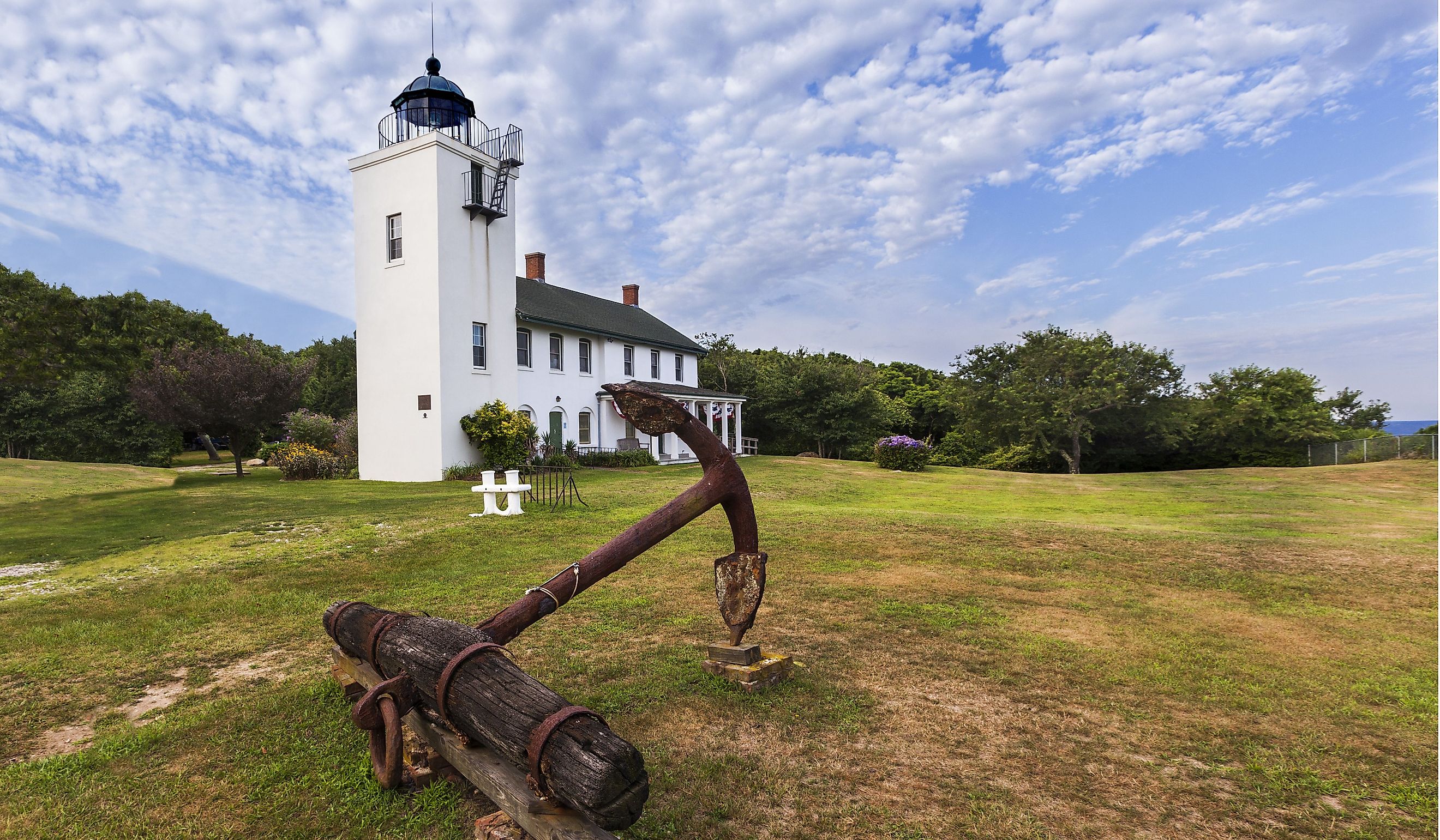 Wide angle view of Horton Point Lighthouse and rustic anchor.