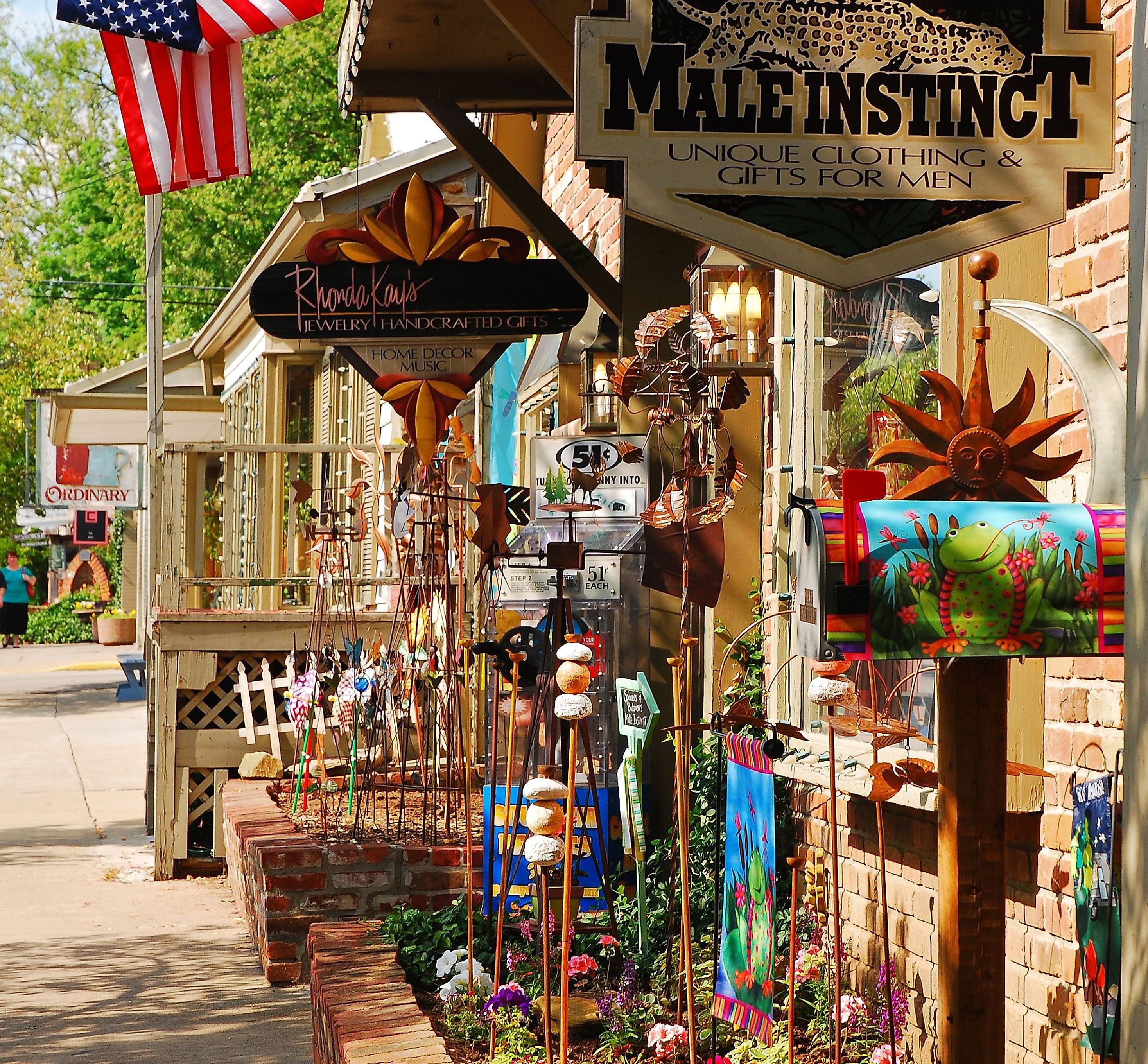 A Boutique Store displays its sales along the sidewalk to entice customers in the charming small town of Nashville, Indiana. Editorial credit: James Kirkikis / Shutterstock.com