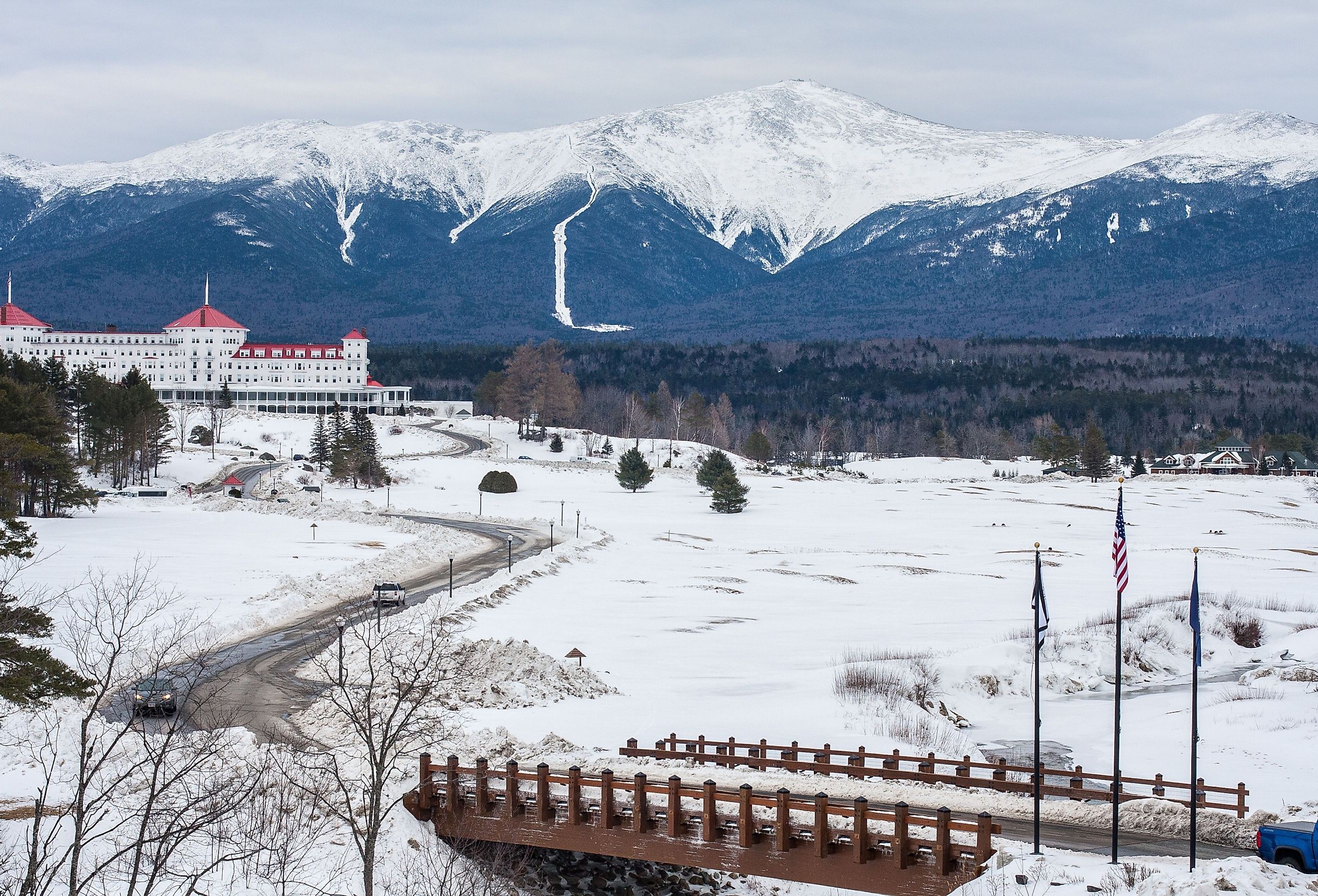 A distant view of Mount Washington, New Hampshire during winter, with the Omni Mount Washington Resort in the foreground.