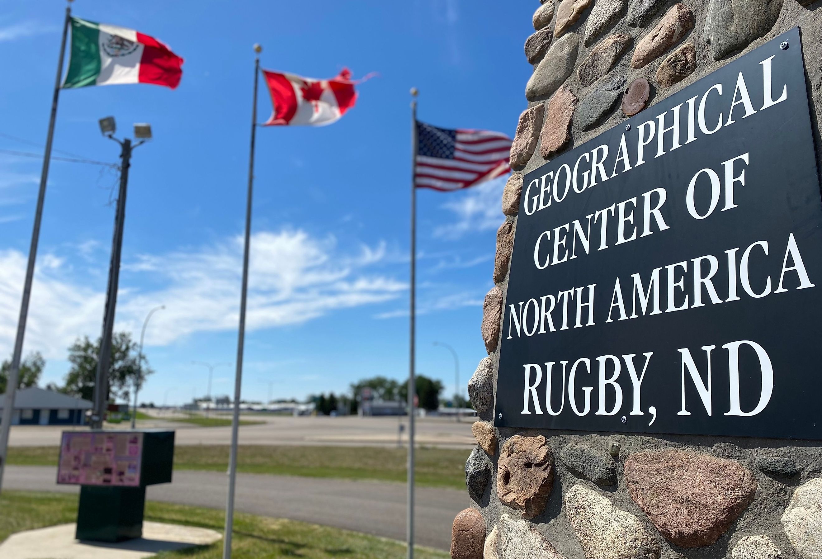 Geographical Center of North America Sign in Rugby, North Dakota with Mexico, Canada and United States Flags