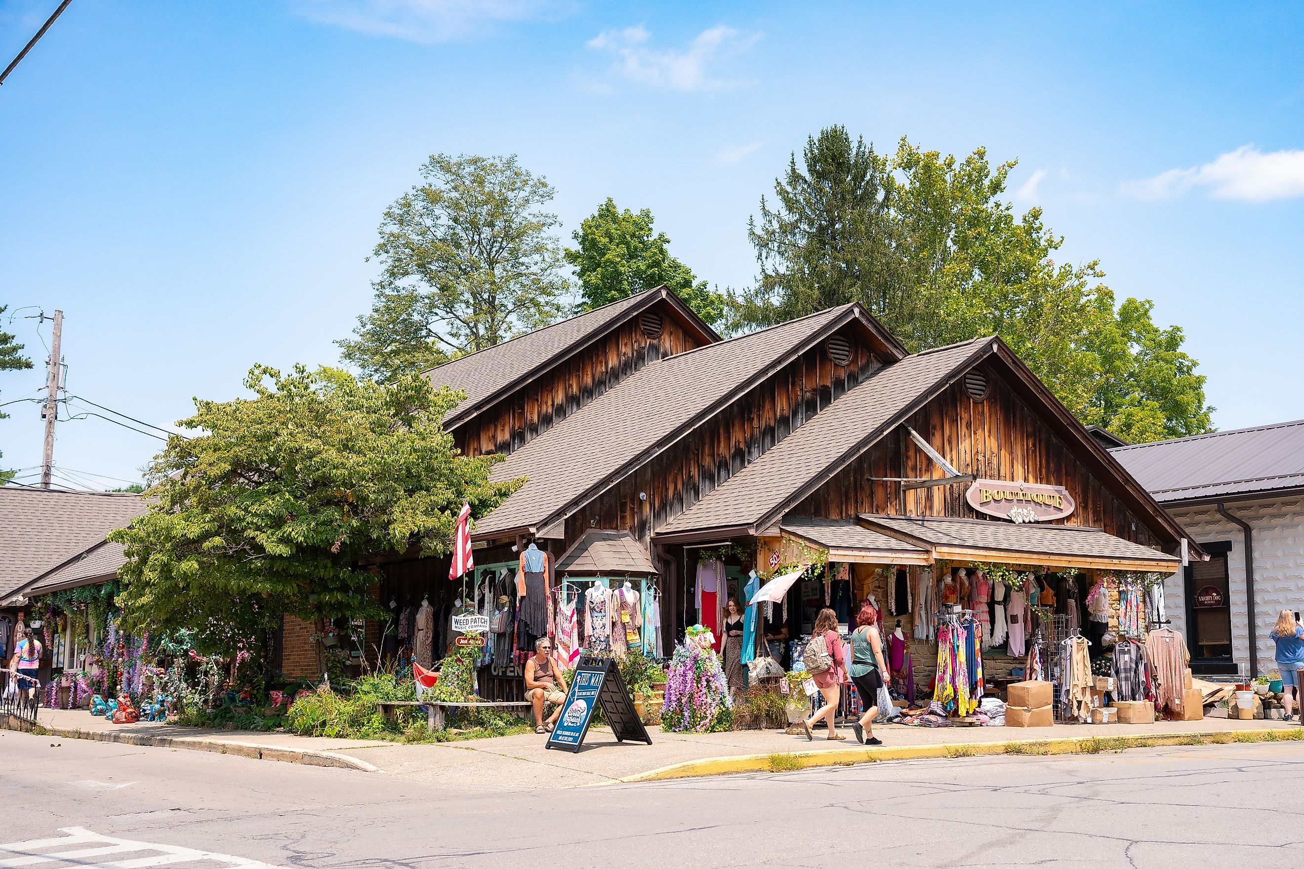 Street scene from historic downtown Nashville, Indiana, in Brown County, featuring people strolling along the sidewalks.  Editorial credit: Little Vignettes Photo / Shutterstock.com