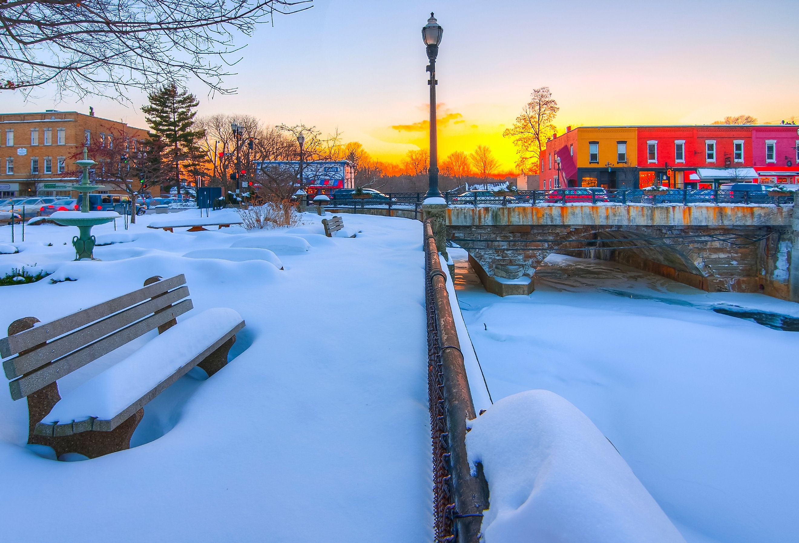 Park along Chagrin River in winter snow, Chagrin Falls, Ohio.